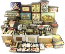A collection of assorted vintage product advertising tins.