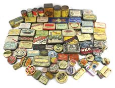 A collection of assorted small vintage product advertising tins.