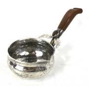 A Peruvian white metal sauce pan.