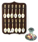A Moorcroft candlestick and spoon collection.