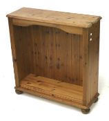 A contemporary pine bookcase with two adjustable shelves.