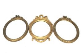 Three gilt framed oval 'Ribbon' wall mirrors. Max H48.