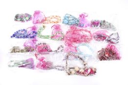 Fifteen hand-crafted necklaces with matching earrings. In various colours, all individually bagged.