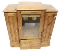 A contemporary pine hi-fi entertainment storage unit.