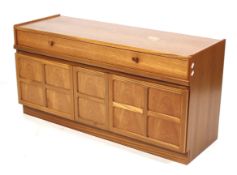 A mid-century Nathan teak sideboard. Two drawers above two cupboards with a central two tier drawer.