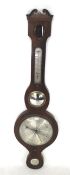 A Victorian mahogany cased banjo barometer.