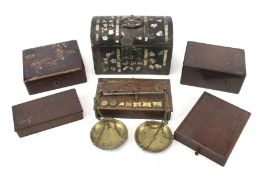 A group of six assorted wooden boxes.