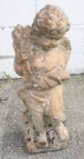 A composite stone cherub garden ornament.