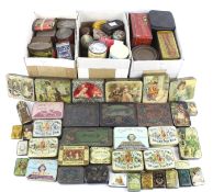 A collection of assorted small vintage product advertising tins.