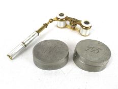 A pair of pewter boxes and a pair of ladies opera glasses.