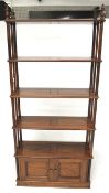 A 20th century mahogany free standing shelving unit.