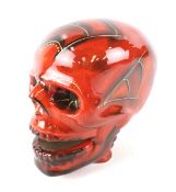 A signed Anita Harris skull.