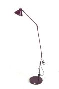 A Habitat 'Bobby' adjustable standard lamp purple. On a circular base.