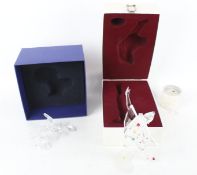 Three boxed pieces of Swarovski. Comprising a clown, fish and a swan, Max.