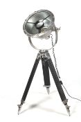 A substantial spot light on a tripod base.