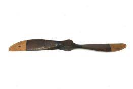 A vintage wooden propeller.
