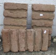 A set of three terracotta coloured concrete slabs.