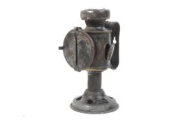 Automobilia - An unusual candle lamp of pedestal form, with a wartime longitudinal Slit ,