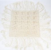 A 20th century cream silk embroidered shawl.