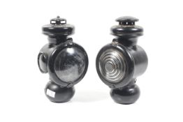 Two automobilia lamps.