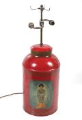 A 19th century large lidded tea tin converted into a lamp.