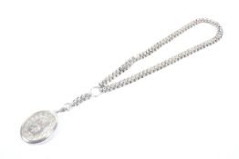 A Victorian silver oval locket, hung from fancy link necklace.