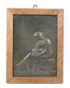 Emmanuel Hannaux (1855-1934) (HANNAVX), patinated bronze plaque depicting a seated woman.