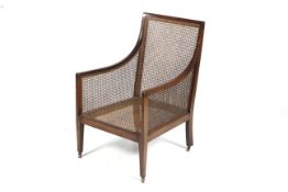 A circa 1915 mahogany Bergere library chair.