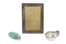 A small group of Victorian and later silver including a silver mounted opaque-green glass