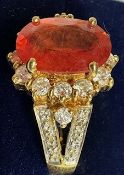 A Gems TV 18ct gold, orange sapphire and near colourless stone oval cluster ring.