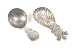 A George III silver silver caddy spoon and another modern of Royal interest.