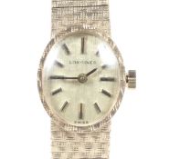 Longines, a lady's 9ct gold oval integral bracelet watch, circa 1979.