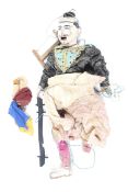 A 20th century marionette of an Asian figure.