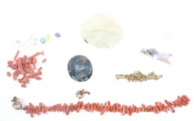 A part-strung branch coral bracelet and a collection of loose stones to include an oval cabochon