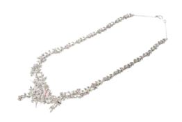 An Edwardian marcasite and coloured paste necklace.