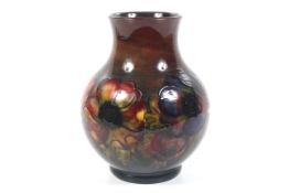 A William Moorcroft signed flambe vase.