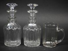 A pair of Georgian glass mallet decanters and a pint mug.