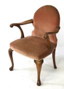 A 20th century open armchair.