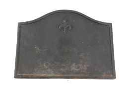 A cast metal fire back.