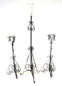 A vintage wrought iron standard lamp and a pair of similar plant stands. Each on tripod stands, Max.