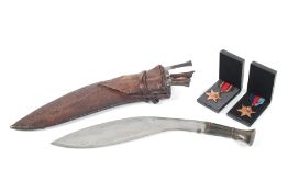 A kukri knife and the Burma Medal and Burma Star medal.