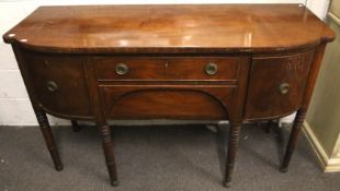 A mahogany bow fronted sideboard.