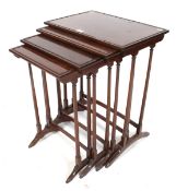 A nest of four (Quartetto) mahogany mid-20th century Victorian style occasional tables.