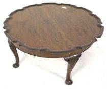 A pie crust edge coffee table.