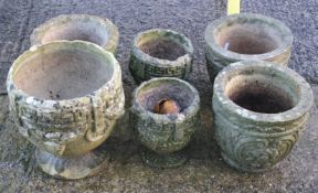 Six composite stone garden pots.