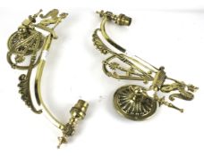 A pair of brass swivel wall light brackets.