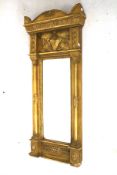 A gilt framed wall mirror.