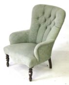 A Victorian button back armchair.