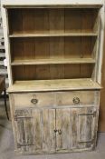 A 'shabby chic' pine dresser.