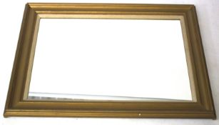 A contemporary gilt framed wall mirror.